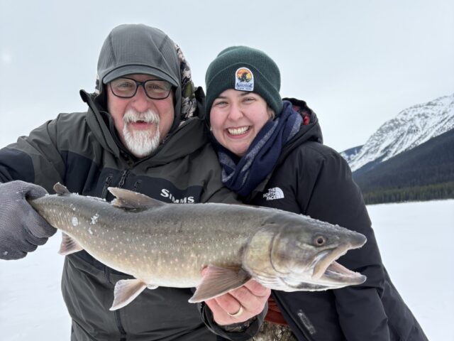 Wapiti ice fishing two people with fish