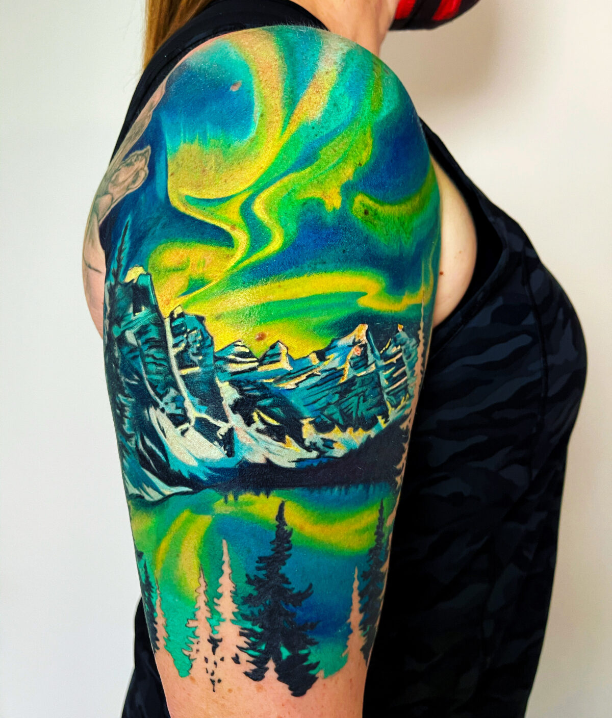 Northern Lights With Wolf by Jake Bertelsen TattooNOW